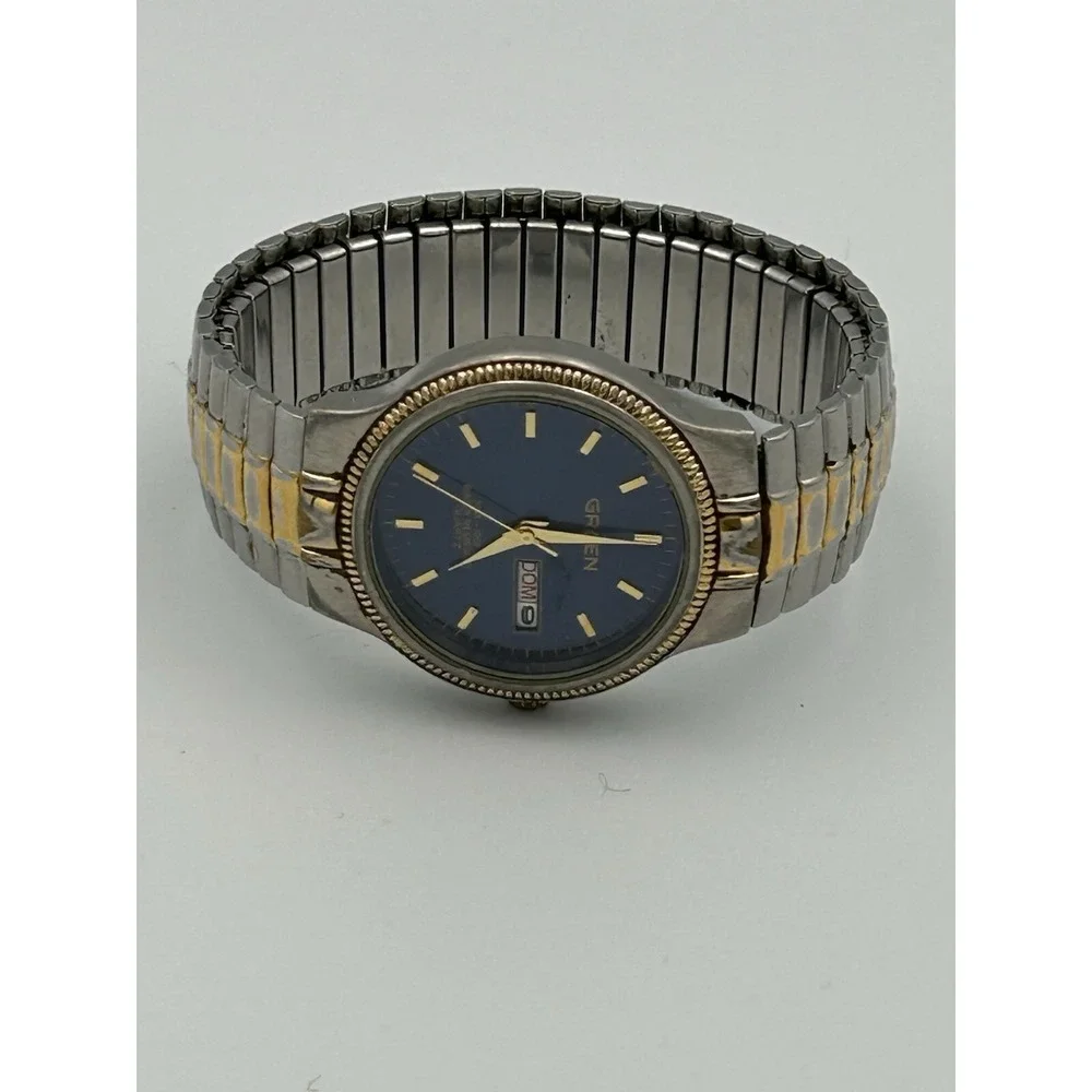 Gruen men's watch GU1022 Blue Face Stainless Steel And Gold Stretch Band Read